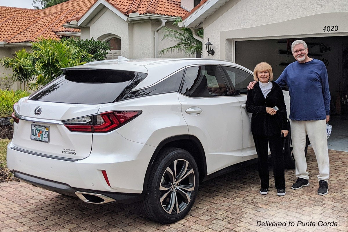 Happy couple gets their Lexus RX350 delivered